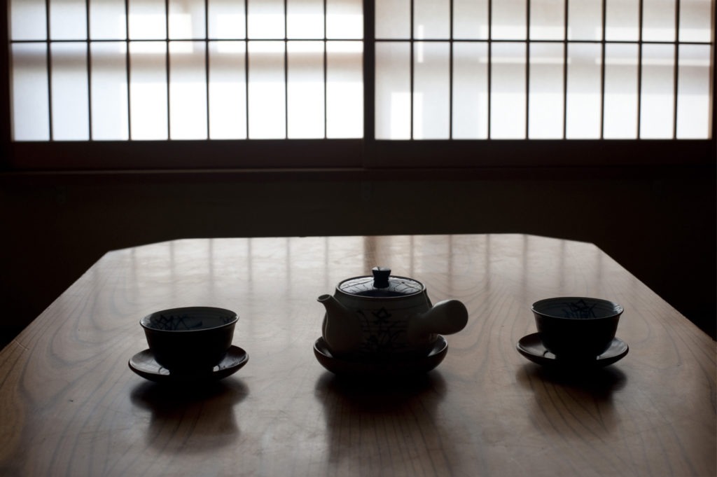 japanese tea pot and cups set out ready to enjoy a cup of green tea